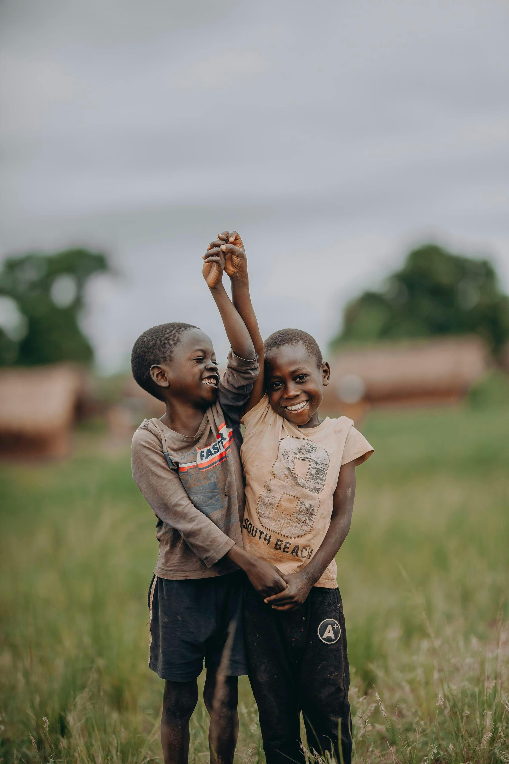 two boys playfully holding hands